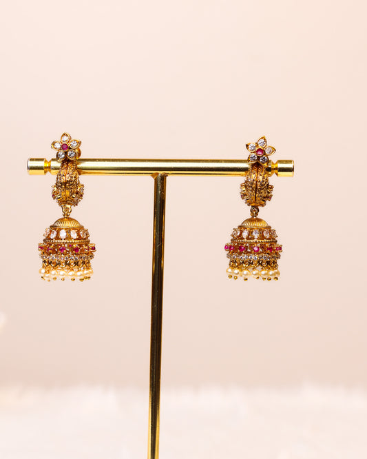 Padmavalli Ruby Pearl  Makara Kundhana Jhumkas premium Gold Polished Earings by Suwarnikaa jewels
