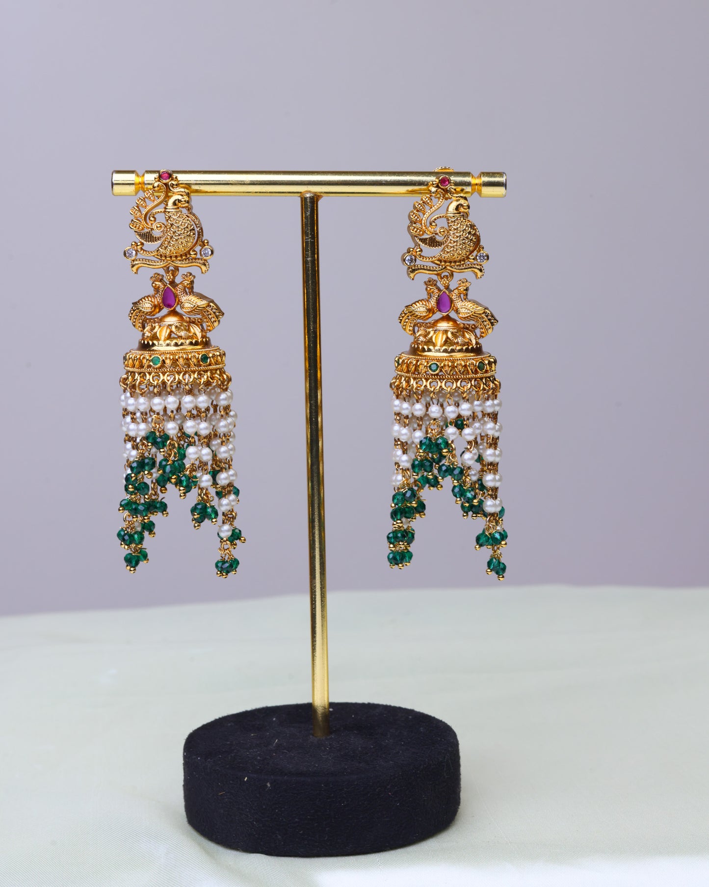 Swarna Mayura emerald Pearl Drop Jhumkas  by Suwarnikaa jewels